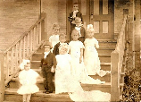 Tom Thumb Wedding - Cyril Ewart-Groom, Ethel Kuehl-Bride.  Front left: Winfred Koske- Flower Girl; Back of Groom, Edwan Tolksman- Best Man, Vivien Risner-Maid of Honor; Next Step Up: Gladys Staton & Ethel Peterson- Bridesmaids; Next Step Up: Arthur Fi